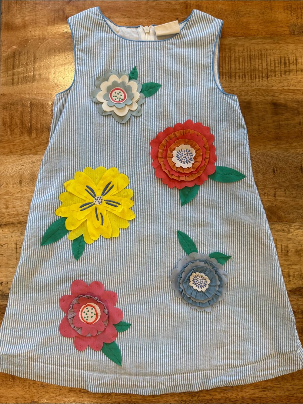 Mini Boden seersucker dress with flower appliqué